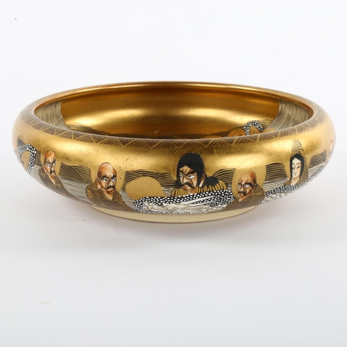 146 - A Japanese Satsuma porcelain bowl, with painted and gilded dragon and figures, diameter 21cm