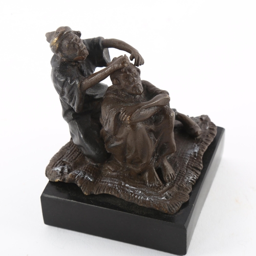 151 - A Franz Bergmann style bronze of man cutting hair, on slate base, overall height 8cm