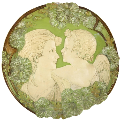 154 - An Ernest Wahliss Art Nouveau wall plaque, depicting Cupid and Psyche, impressed back stamp to rever... 