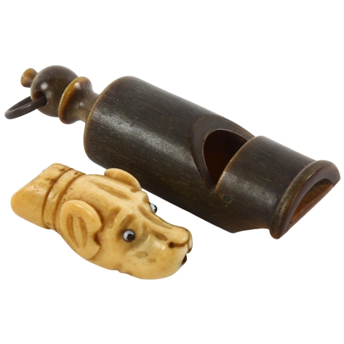 166 - An Antique bone dog's head whistle, and a turned horn whistle