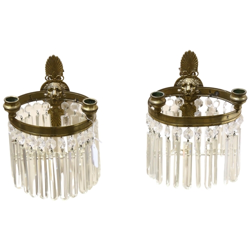 177 - A pair of early 20th century lion head wall sconces, with crystal lustre drops, overall height 29cm