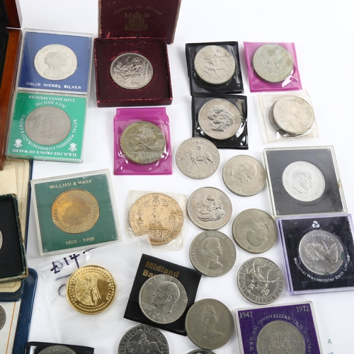 185 - A collection of British commemorative coins, including Festival of Britain crowns, and 88mm Royal ba... 