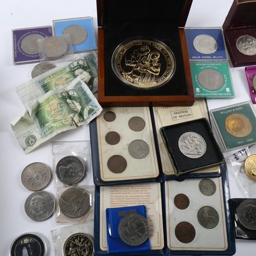 185 - A collection of British commemorative coins, including Festival of Britain crowns, and 88mm Royal ba... 