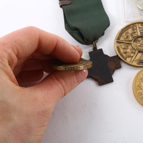 187 - A small collections of medals and medallions, including London County Council and Driver's medals