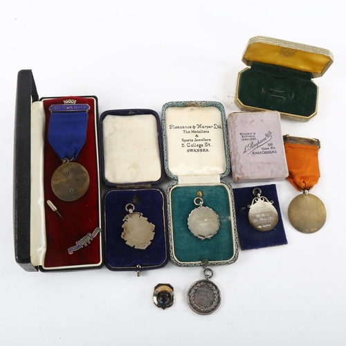 188 - A collection of 8 silver medals and awards, including scouting and sporting interest