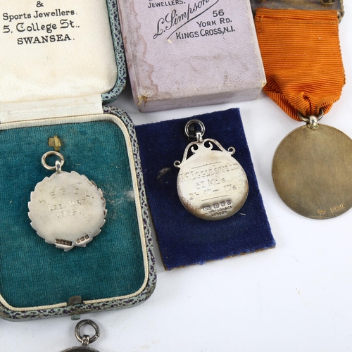 188 - A collection of 8 silver medals and awards, including scouting and sporting interest