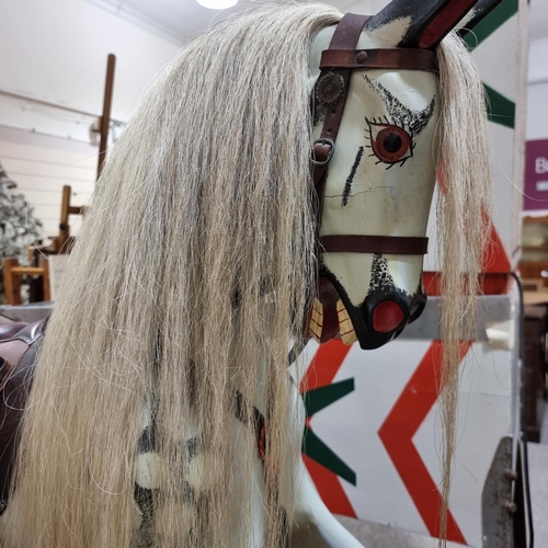 57 - An early 20th Century dappled grey Rocking Horse in the manner of F.H.Ayres, London, with studded le... 