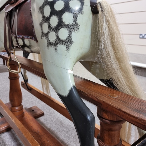 57 - An early 20th Century dappled grey Rocking Horse in the manner of F.H.Ayres, London, with studded le... 