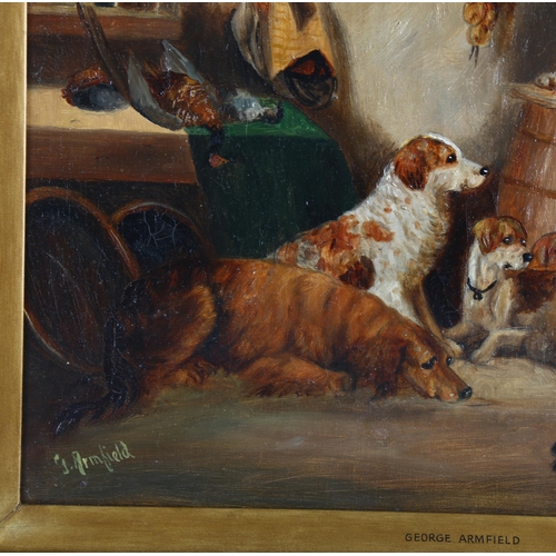 695 - Manner of George Armfield, dogs in an interior, oil on canvas, bears signature, 31cm x 41cm, framed