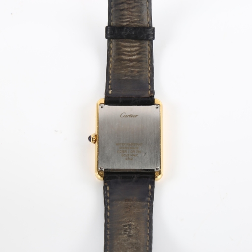 1001 - CARTIER - an 18ct gold and stainless steel Tank Solo quartz wristwatch, ref. 2742, silvered dial wit... 