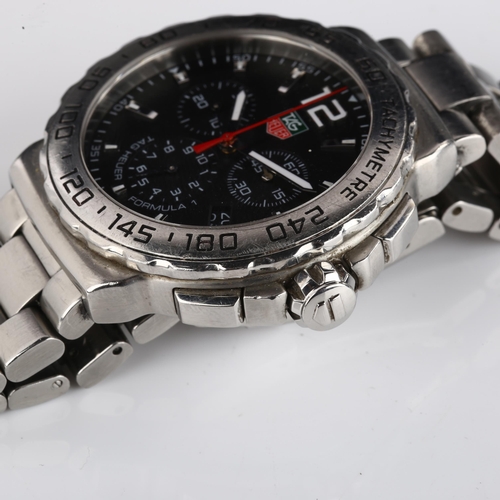 1006 - TAG HEUER - a stainless steel Formula 1 quartz chronograph bracelet watch, ref. CAU1112, black dial ... 