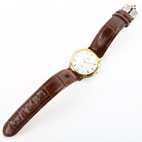 1014 - OMEGA - a gold plated stainless steel De Ville quartz wristwatch, white dial with Roman numeral hour... 