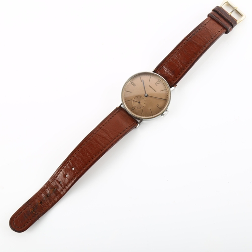 1017 - LONGINES - a stainless steel Calatrava mechanical wristwatch, circa 1942, bronzed dial with quarterl... 