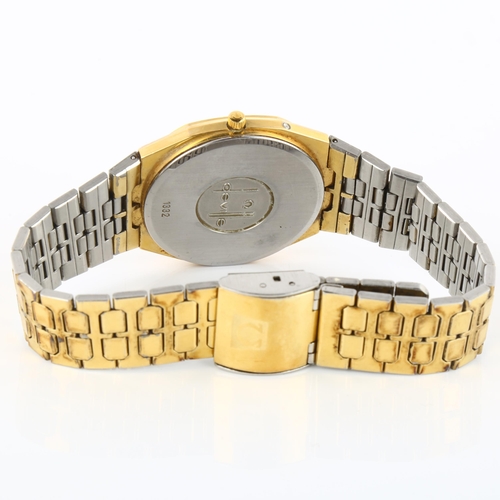 1019 - OMEGA - a gold plated stainless steel De Ville quartz bracelet watch, ref. 1332, champagne dial with... 