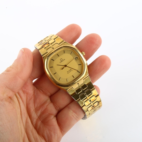 1019 - OMEGA - a gold plated stainless steel De Ville quartz bracelet watch, ref. 1332, champagne dial with... 