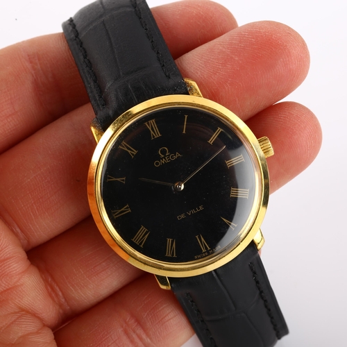 1027 - OMEGA - a gold plated De Ville mechanical wristwatch, ref. 111.077, circa 1969, black dial with gilt... 