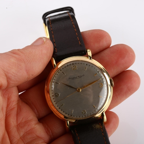 1036 - IWC (INTERNATIONAL WATCH CO) - a Vintage 18ct gold mechanical wristwatch, circa 1950s, silvered dial... 