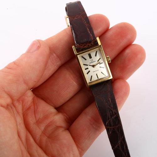 1052 - OMEGA - a lady's gold plated stainless steel Geneve mechanical wristwatch, ref. 511.357, circa 1970,... 