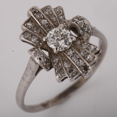 1104 - An Art Deco diamond fan cocktail ring, unmarked white metal geometric settings with old European and... 