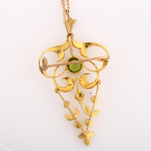 1110 - An Edwardian peridot and pearl openwork pendant necklace/brooch, with V-shaped drop and 9ct fine fla... 