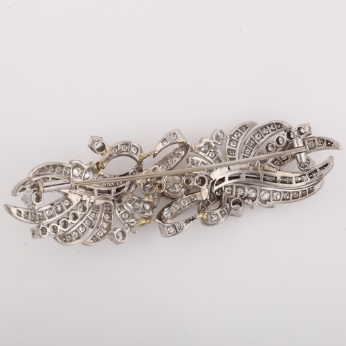 1114 - A fine Belle Epoque diamond brooch, ribbon design set with modern round brilliant and baguette-cut d... 