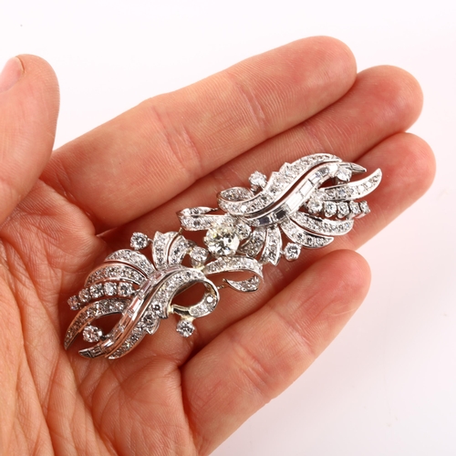 1114 - A fine Belle Epoque diamond brooch, ribbon design set with modern round brilliant and baguette-cut d... 