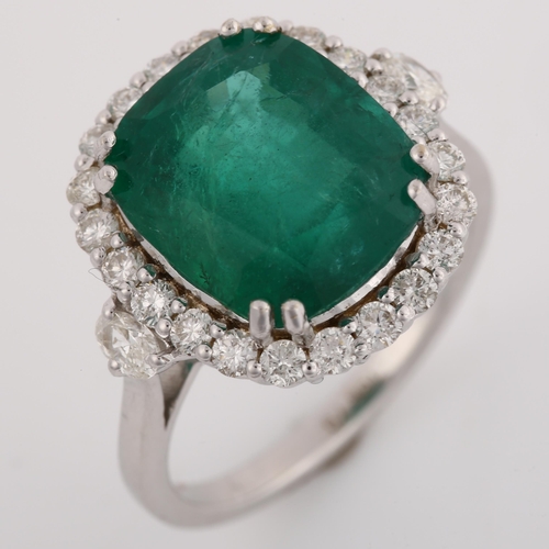 1122 - A modern 18ct white gold emerald and diamond cluster ring, set with 6.5ct oval cushion-cut emerald a... 