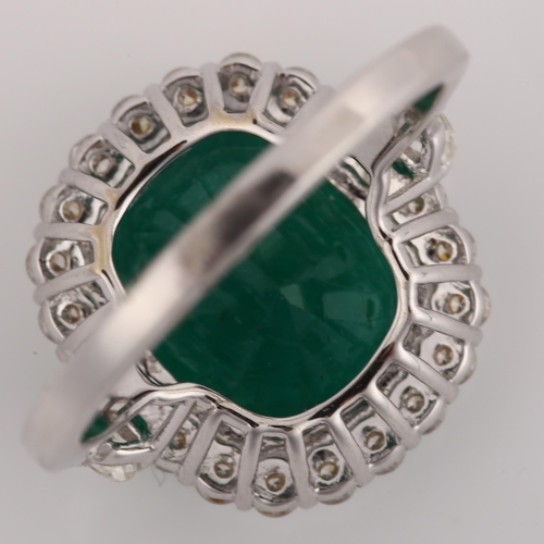 1122 - A modern 18ct white gold emerald and diamond cluster ring, set with 6.5ct oval cushion-cut emerald a... 