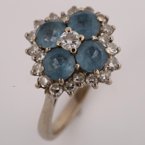 1128 - An 18ct white gold blue topaz and diamond cluster ring, setting height 15.9mm, size P, 6.1g