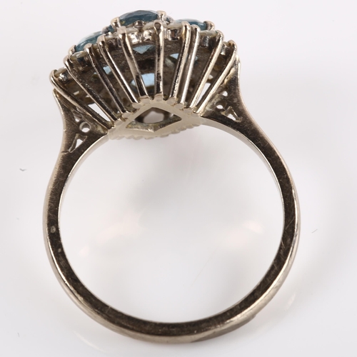 1128 - An 18ct white gold blue topaz and diamond cluster ring, setting height 15.9mm, size P, 6.1g