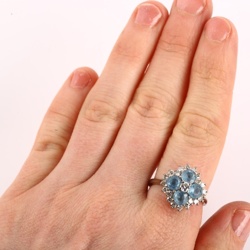 1128 - An 18ct white gold blue topaz and diamond cluster ring, setting height 15.9mm, size P, 6.1g