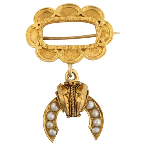 1129 - A Victorian Etruscan style split pearl memorial drop brooch, with a central vacant panel within flor... 