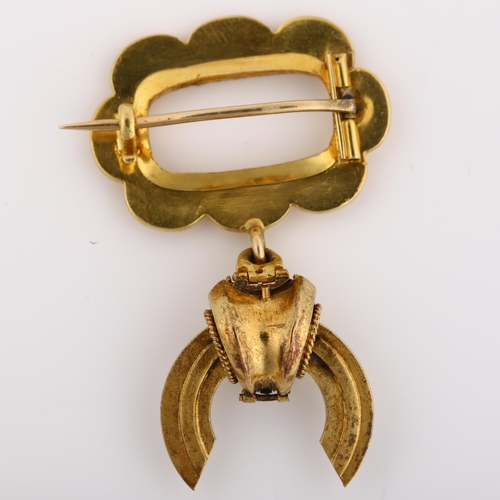 1129 - A Victorian Etruscan style split pearl memorial drop brooch, with a central vacant panel within flor... 