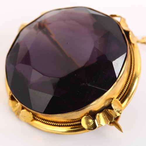 1130 - A large Victorian amethyst brooch, unmarked gold frame set with round-cut amethyst, brooch diameter ... 