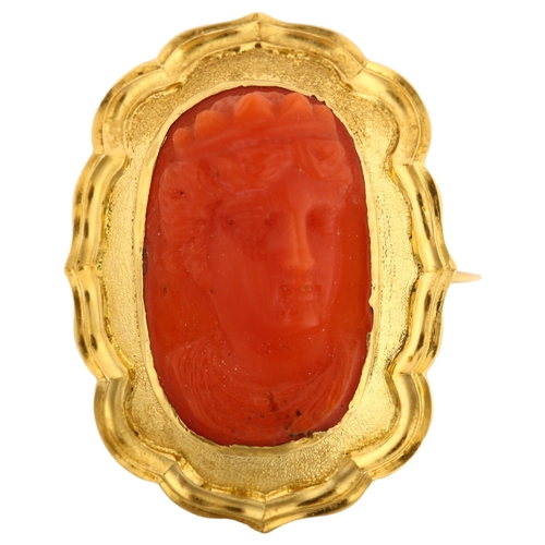 1133 - A Victorian coral cameo brooch, unmarked yellow metal frame with relief carved coral panel depicting... 