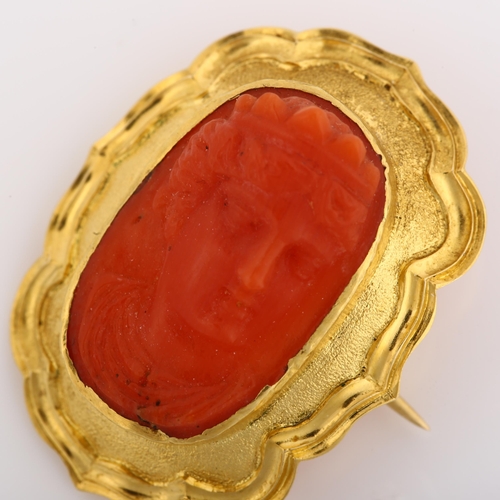 1133 - A Victorian coral cameo brooch, unmarked yellow metal frame with relief carved coral panel depicting... 