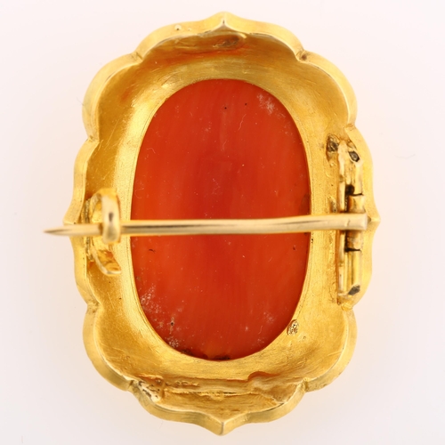 1133 - A Victorian coral cameo brooch, unmarked yellow metal frame with relief carved coral panel depicting... 