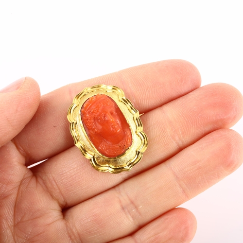 1133 - A Victorian coral cameo brooch, unmarked yellow metal frame with relief carved coral panel depicting... 