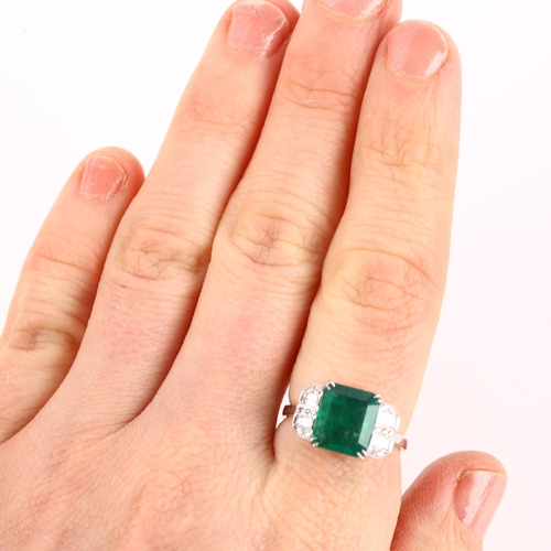 1142 - A modern 18ct white gold emerald and diamond ring, in Art Deco style, set with 2.5ct emerald-cut eme... 