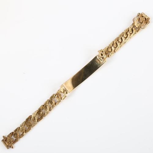 1143 - A late 20th century 9ct gold identity bracelet, with textured flat curb links, maker's marks R Co, h... 