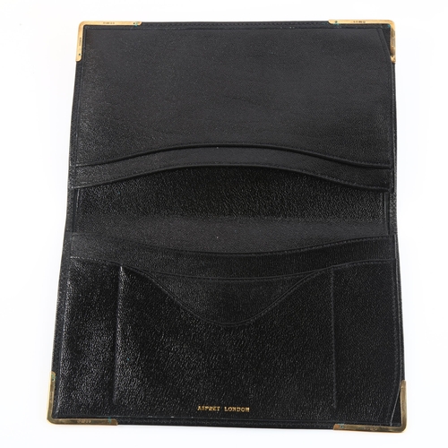 1152 - ASPREY - a late 20th century 9ct gold mounted black leather wallet, stamped Asprey London, hallmarks... 