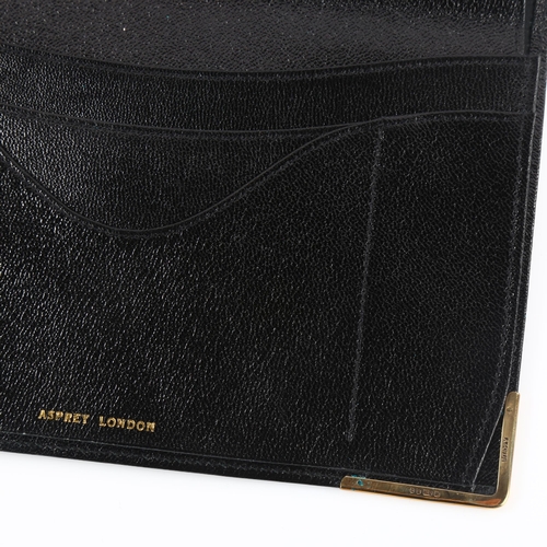 1152 - ASPREY - a late 20th century 9ct gold mounted black leather wallet, stamped Asprey London, hallmarks... 