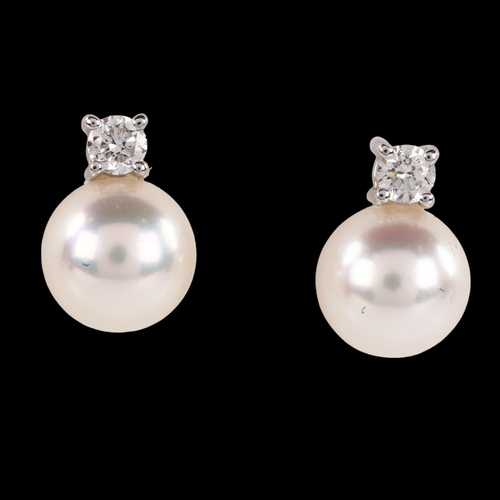 1156 - A pair of 18ct white gold whole pearl and diamond earrings, with stud fittings, earring height 10.2m... 