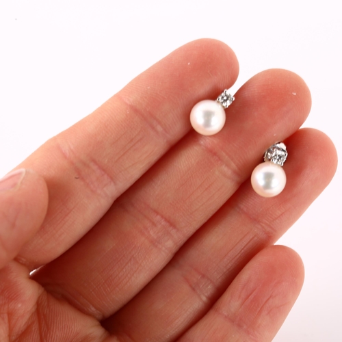 1156 - A pair of 18ct white gold whole pearl and diamond earrings, with stud fittings, earring height 10.2m... 