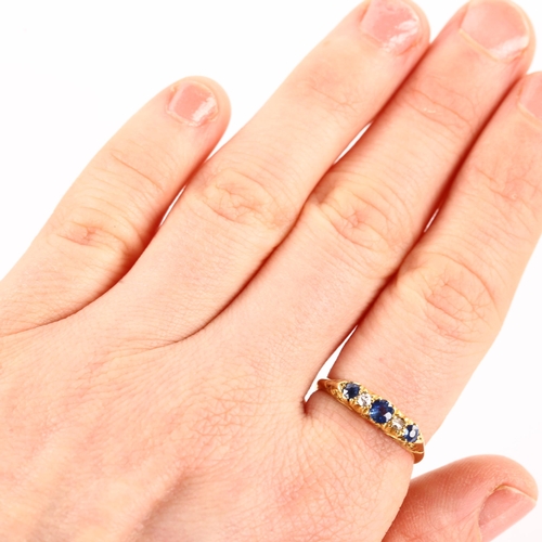 1161 - An early 20th century 18ct gold graduated five stone sapphire and diamond half hoop ring, hallmarks ... 