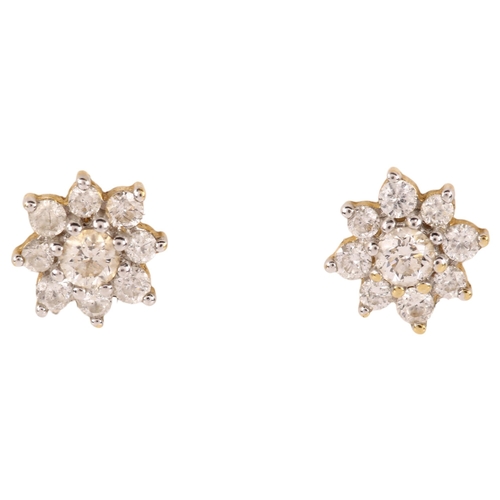 1162 - A pair of 18ct gold diamond flowerhead earrings, with stud fittings, earring diameter 6.5mm, 1.5g