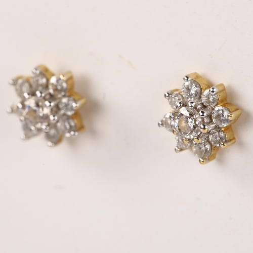 1162 - A pair of 18ct gold diamond flowerhead earrings, with stud fittings, earring diameter 6.5mm, 1.5g