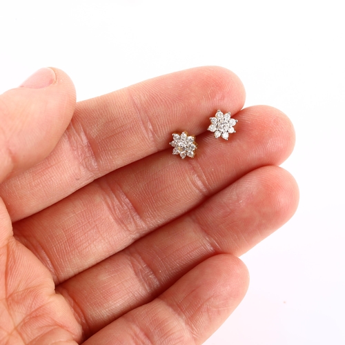 1162 - A pair of 18ct gold diamond flowerhead earrings, with stud fittings, earring diameter 6.5mm, 1.5g