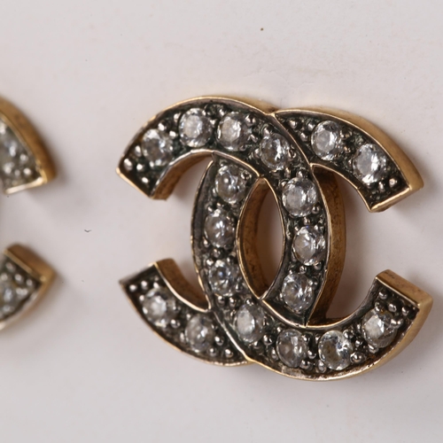 1165 - CHANEL - a pair of CC logo earrings, unmarked yellow metal settings with cubic zirconia, logo width ... 