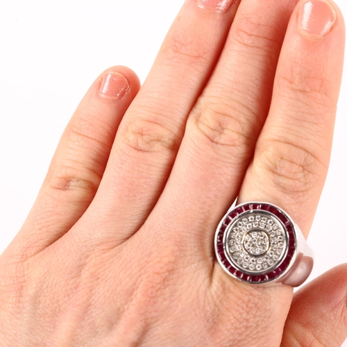 1166 - A large modern 18ct white gold ruby and diamond cluster target ring, set with calibre-cut rubies and... 